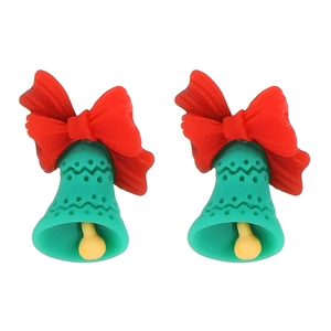 Detailed view of green Christmas bell earrings with red resin bow on a white background