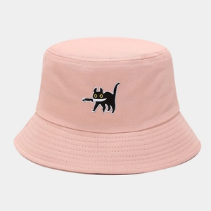 Detailed close-up of pink bucket hat with funny black cat embroidery and stitched brim