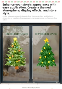 Detailed watercolor Christmas tree window stickers on a glass shop door with yellow stars