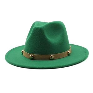 Close-up of green wool fedora hat with brown leather band and gold rivet details