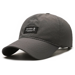 Breathable dark grey quick-dry baseball cap with laser-cut holes and brand patch