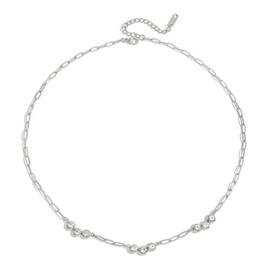 Silver paperclip necklace with white zircon accents in a modern minimalist circle display