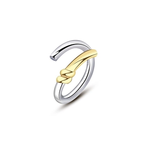 Macro shot of S925 sterling silver twisted rope ring with dual-tone gold and silver finish