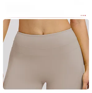 Detail of high-waisted yoga pants with tummy control and anti-slip waistband feature