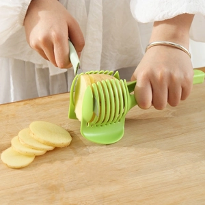 Green plastic manual slicer guide for cutting uniform potato and tomato slices