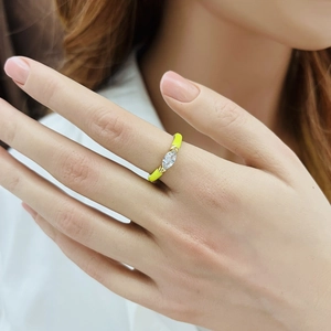 Detail of yellow enamel drop ring with marquise cut crystal inlay in gold finish