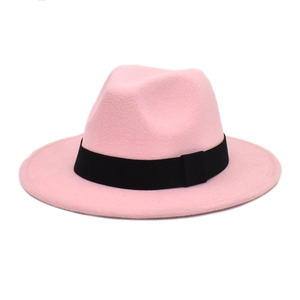 Close-up of pink wool fedora featuring a wide black elastic band and smooth felt texture