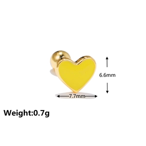 Detailed view of yellow enamel heart stud earring with golden metal and screw back ball