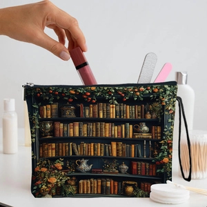 Vintage bookshelf floral makeup bag with zipper and handle showing lipstick storage