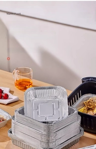 Stackable aluminum foil trays for air fryer showing crispy fried chicken inside a kitchen