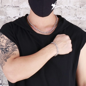 Men's 7mm silver snake curb chain necklace and bracelet set shown on tattooed male model