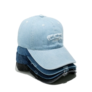 Distressed denim baseball caps with 1987 embroidery in various blue and black washes