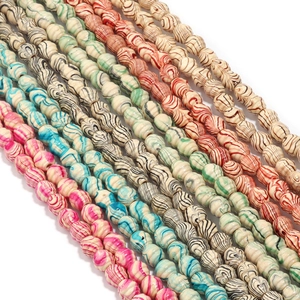 Colorful threaded wood beads for DIY jewelry making shown in a diagonal neat arrangement