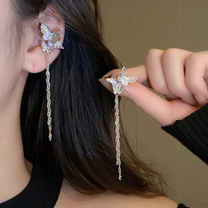 Detail of silver butterfly ear cuffs with sparkling zircon tassels on a model