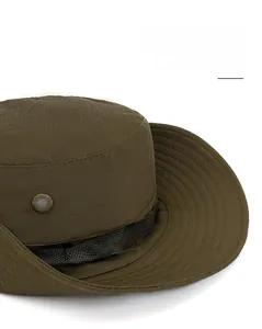 Detail of dark green wide-brim sun hat featuring ripstop fabric and metal ventilation eyelets