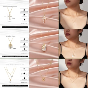 Three gold-plated 925 silver necklaces with freshwater pearls and cross-shaped zircon pendants
