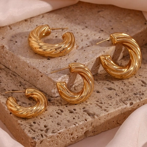 Set of four 18K gold plated stainless steel U-shape twisted C-ring earrings on stone