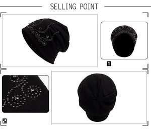 Detailed close-up of sparkling rhinestone patterns on a black slouchy knit beanie