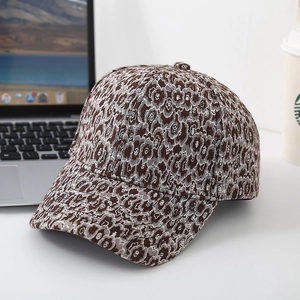 Fashionable leopard print wide brim baseball cap on office desk with urban lifestyle vibe