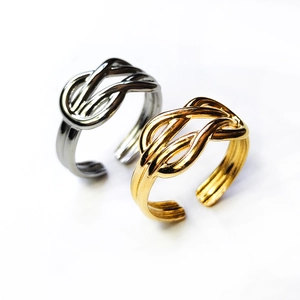 Adjustable titanium steel knot rings in gold and silver finish on white background