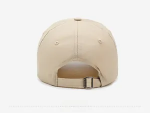 Detail view of beige quick-dry baseball cap with adjustable metal buckle on the back