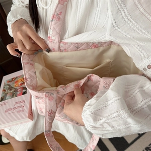 Detail view of pink floral quilted cotton tote bag with spacious inner pocket