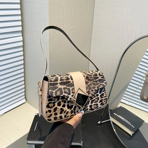 Fashionable leopard print faux fur shoulder bag with beige strap and black square buckle