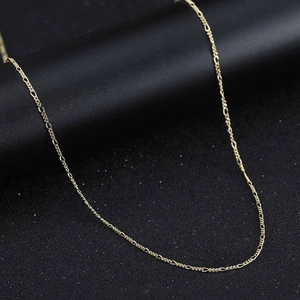 Detailed macro shot of a golden twisted rope chain made of polished S925 sterling silver