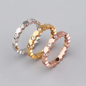 Three-piece stackable wavy rings set with cubic zirconia in silver, gold, and rose gold