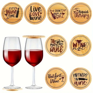 Macro view of round wooden wine coasters featuring unique engraved humorous phrases