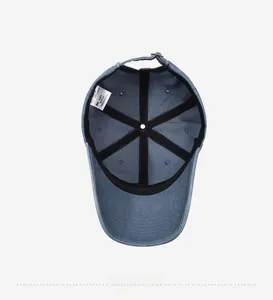 Detail view of the interior structure of the navy blue cotton baseball cap with adjustable strap