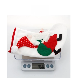Detailed view of white Nordic Christmas stocking with Santa embroidery weighing 46.8 grams