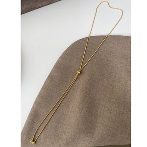 Minimalist adjustable 18k gold plated snake chain Y-necklace with ball pendant on fabric