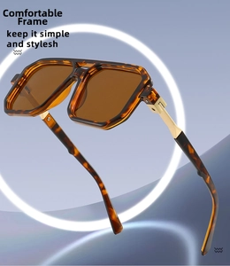 Detailed view of tortoiseshell sunglasses frame with premium gold metal temple accents