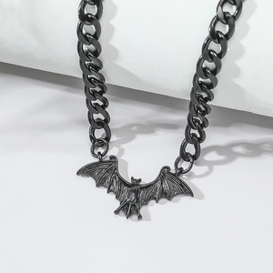 Detailed view of a black metal bat pendant on a thick link chain for Halloween