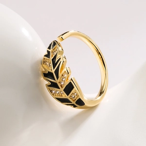 Gold plated open ring with leaf design featuring black enamel and zircon accents