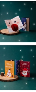Detail of 3D pop-up Santa Claus Christmas card with artistic Merry Christmas font