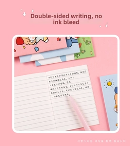 Detail of cute cartoon notebook with smooth paper for double-sided writing and pen