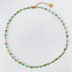 Flat lay of handmade colorful crystal bead choker with gold clasp and extension chain