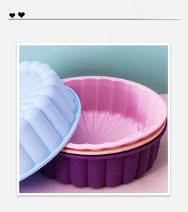 Macro shot of thick silicone cake molds with petal edges in blue, pink, and purple colors