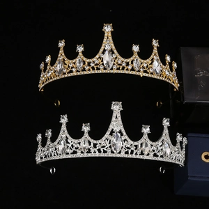 Luxurious crystal tiaras in gold and silver finish with rhinestones on black background