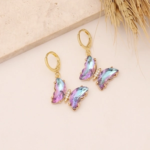Macro detail of gradient butterfly earrings with 18K gold plating and cubic zirconia