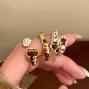 Vintage gold plated ring set with tiger eye stone and zircons for a layered aesthetic