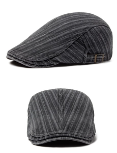 Detail of dark grey striped ivy cap featuring a vintage copper adjustable side buckle