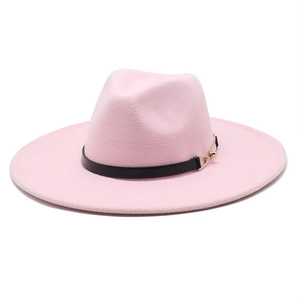 Detail of light pink wool fedora hat featuring a black leather band and gold buckle
