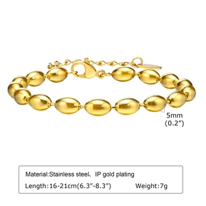 Detailed view of gold plated olive bead bracelet with lobster clasp and extension chain