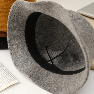 Close-up view of the interior details of a gray knitted winter bucket hat for women.