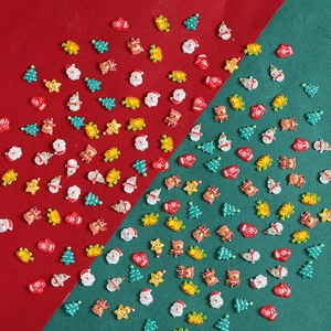 Mix of mini resin Christmas charms featuring Santa, reindeer, and trees for DIY crafts