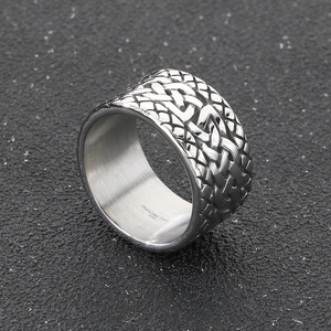 Close-up of woven texture pattern and 316L stainless steel engraving on silver band