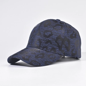 Detail of dark blue leopard print baseball cap featuring textured jacquard fabric finish